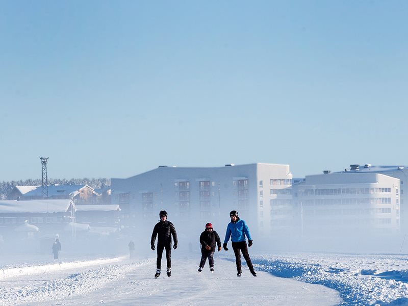 People skating on the ice track in Luleå