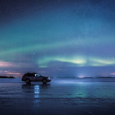 Northern lights and the ice road in Luleå