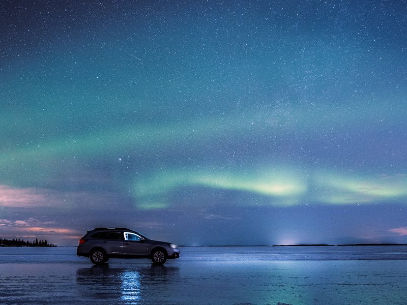 Northern lights and the ice road in Luleå