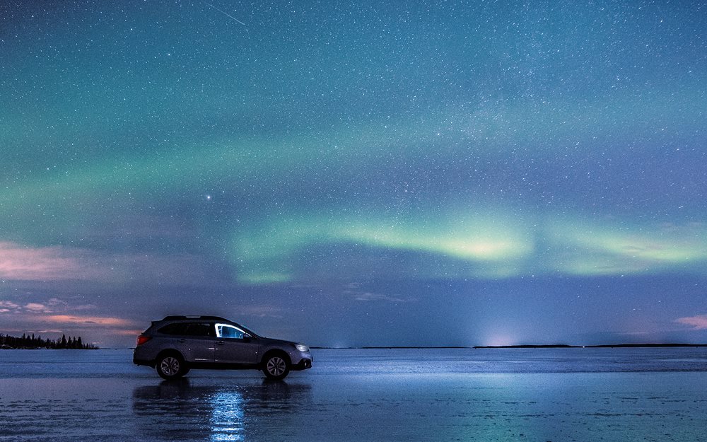 Northern lights and the ice road in Luleå