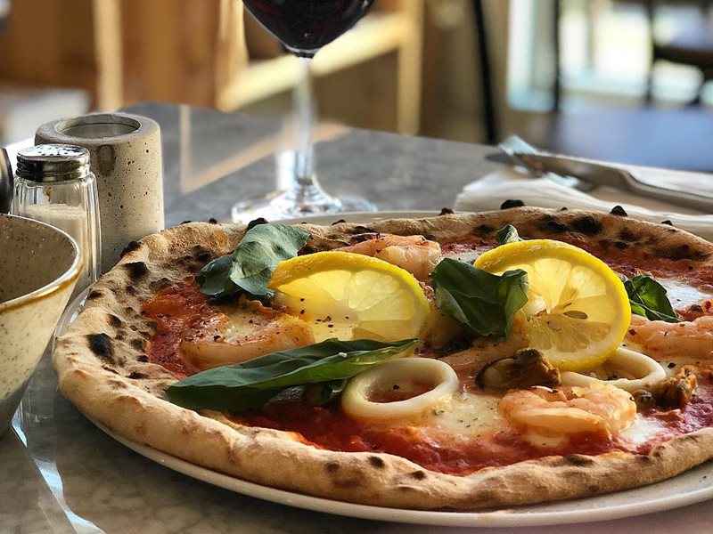 Pizza and red wine at Taverna Gusto